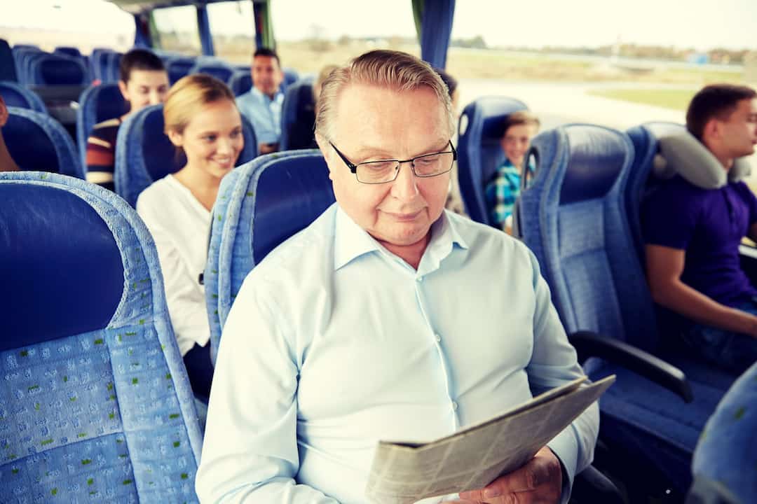 Man on bus | Featured image for Fair Trading Public Holidays.